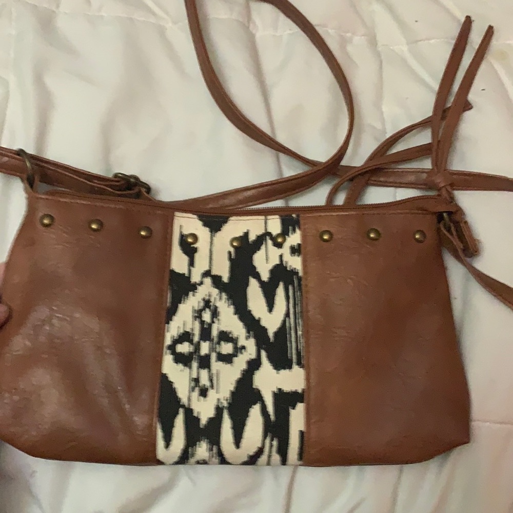 Brown purse ,black and cream colored pattern